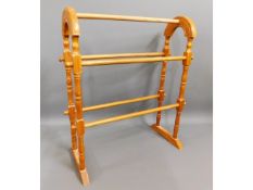 A modern pine towel rail, 29in high x 21.25in wide