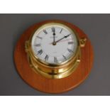A mounted Vetus brass quartz ships clock, 7.7375in