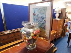 A large glass jar with Christmas baubles twinned w