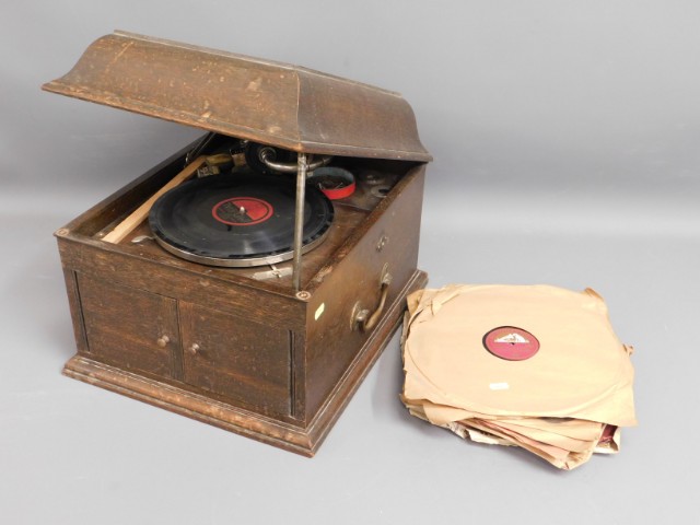 An HMV gramophone with 78's, lid a/f