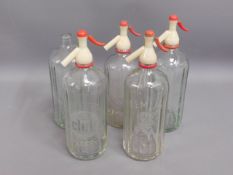 Five vintage soda syphons & bottles