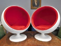 A pair of retro styled child's ball chairs, 40in h