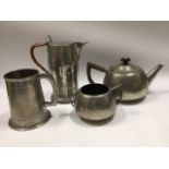 A pewter teapot, coffee pot & sugar bowl twinned w