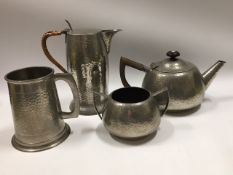 A pewter teapot, coffee pot & sugar bowl twinned w
