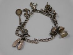 A small silver charm bracelet, 24.2g