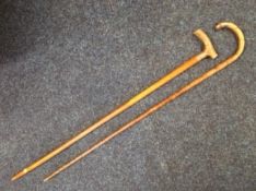 Two walking canes with silver collars