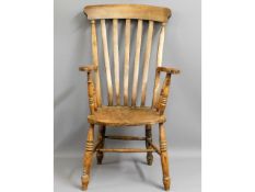 A c.1900 elm seated Windsor style armchair, 45.5in