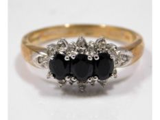 A 9ct gold diamond & sapphire ring, size O/P, 2.9g