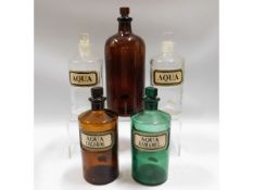 Five apothecary bottles including four with origin