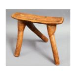 An unusual antique three legged stool, possibly Af