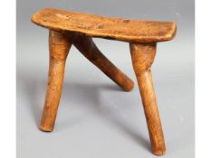 An unusual antique three legged stool, possibly Af