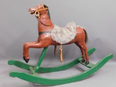 A vintage child's rocking horse, 45in wide x 32in