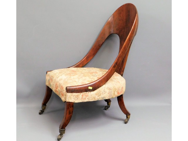 An early 19thC. spoon back chair, possibly birch,