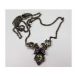 A silver necklace set with marcasite, amethyst & p