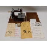 An Essex miniature sewing machine with original bo