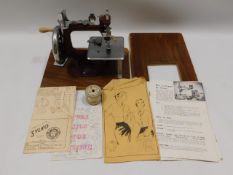 An Essex miniature sewing machine with original bo