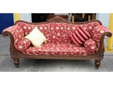 A 19thC. mahogany chaise longue with carved decor,