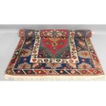 A decorative wool rug, 72in x 46.5in