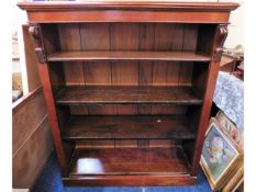 A Victorian floor standing mahogany open bookcase