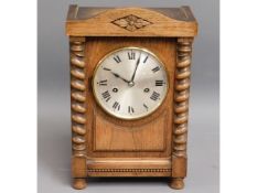 An antique oak cased mantle clock, 13.75in high x