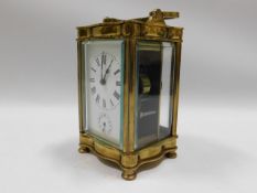 A brass serpentine fronted carriage clock, 6in tal