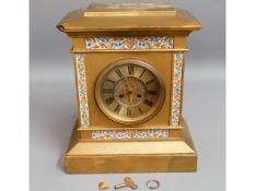A heavy, 19thC. cast iron gilded clock, chip to co