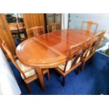 A Chinese rosewood extending dinging table suite w