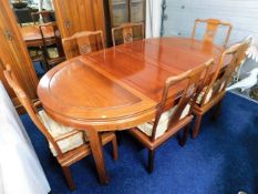 A Chinese rosewood extending dinging table suite w