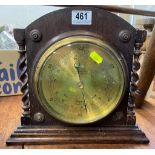 An oak cased brass barometer with barley twist sup