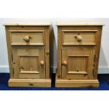 A pair of pine bedside cupboards with drawer, 25.7