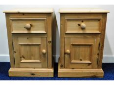 A pair of pine bedside cupboards with drawer, 25.7