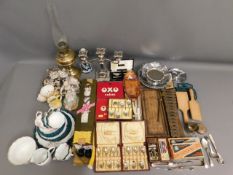 A vintage xylophone, two vintage Oxo tins, a boxed