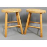 A pair of elm & beech milking stools, 17.25in high