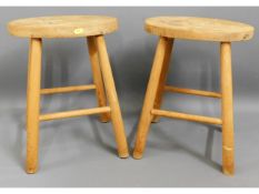 A pair of elm & beech milking stools, 17.25in high