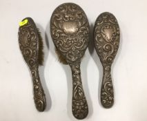 Three silver backed brushes a/f