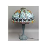 A Tiffany style lamp with coloured glass shade, 26