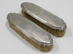 A pair of silver mounted clothes brushes