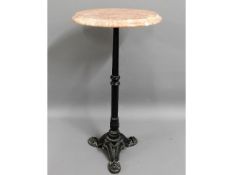 A cast iron table with marble top, 24in high x 12i