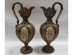 A pair of German majolica ewers, 14.125in tall