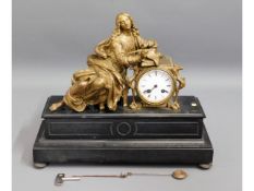 A 19thC. French spelter figurative clock of scribe