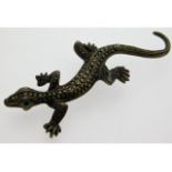A white metal lizard brooch set with marcasite, 12