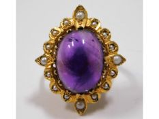 A 9ct gold ring set with amethyst & pearl, 7.2g