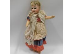 An Armand Marseille porcelain headed doll, 14in ta