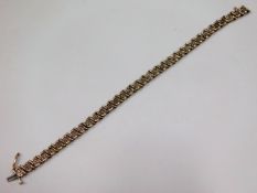 A 9ct gold bracelet set with small diamonds, 7.5in