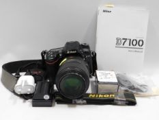 A Nikon D7100 digital SLR camera with 105mm macro