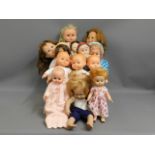 A quantity of 13 mixed dolls including Fisher Pric