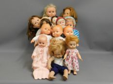 A quantity of 13 mixed dolls including Fisher Pric