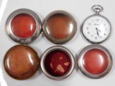 A Ingersoll pocket watch, runs when wound twinned