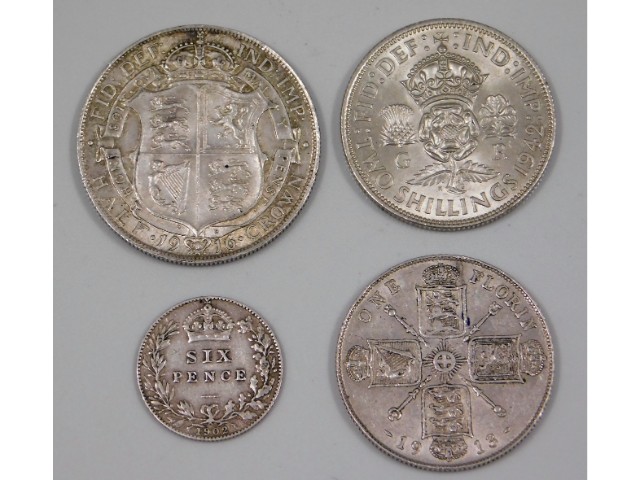 A 1902 sixpence; 1916 Half Crown; 1913 Florin; 1942 two shilling, 39.7g - all of good grade