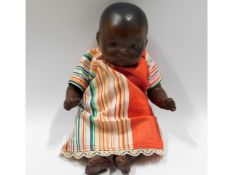 An Armand Marseille porcelain headed doll, 8in tal